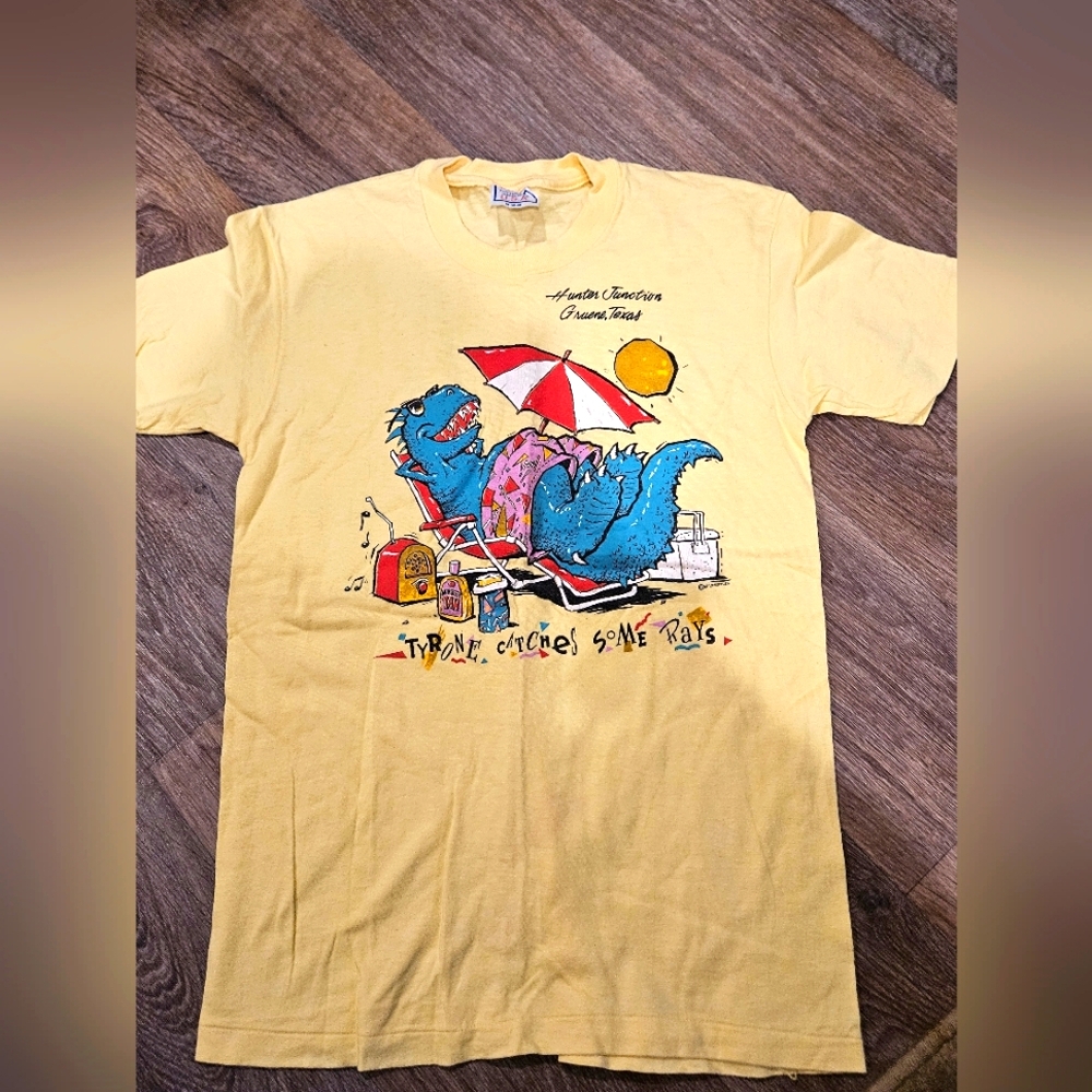 Vintage 1987 Yellow Graphic T-Shirt with Dinosaur Print